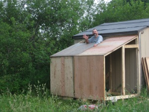 Putting on the plywood roof.